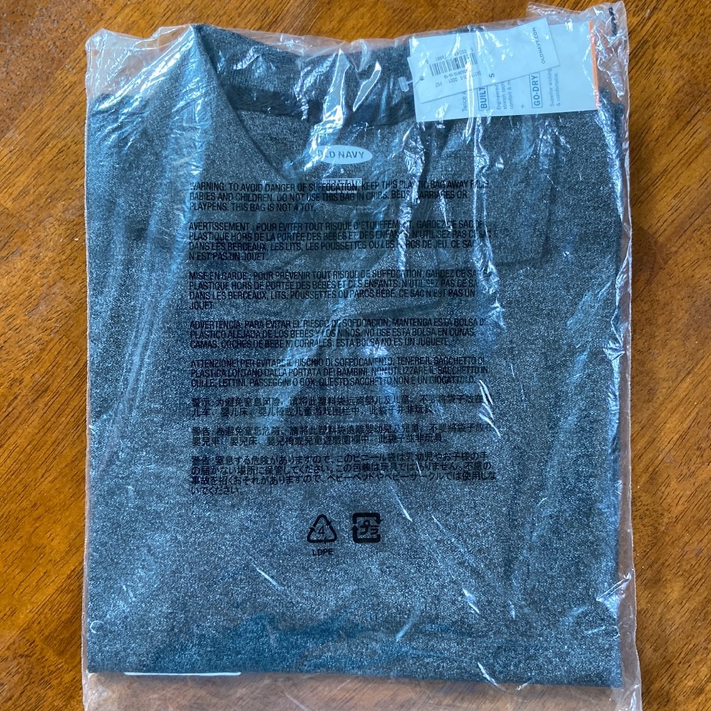 Old Navy Men’s Polo shirt size small. Color is black Heather. New in package